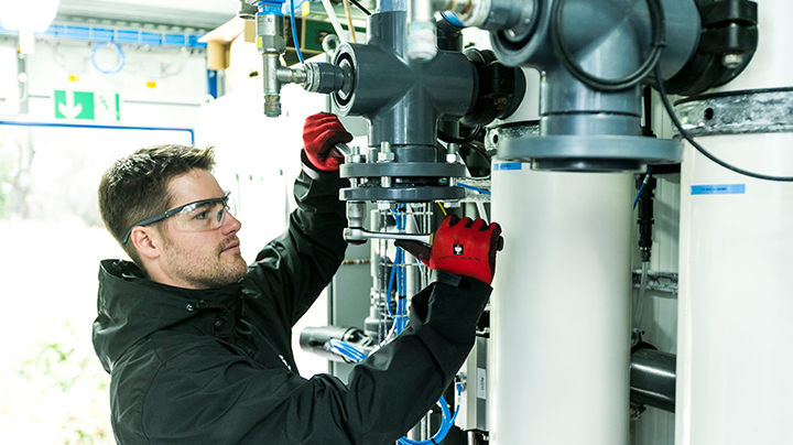 Service respresentative man provides technical support on ultrafiltration system